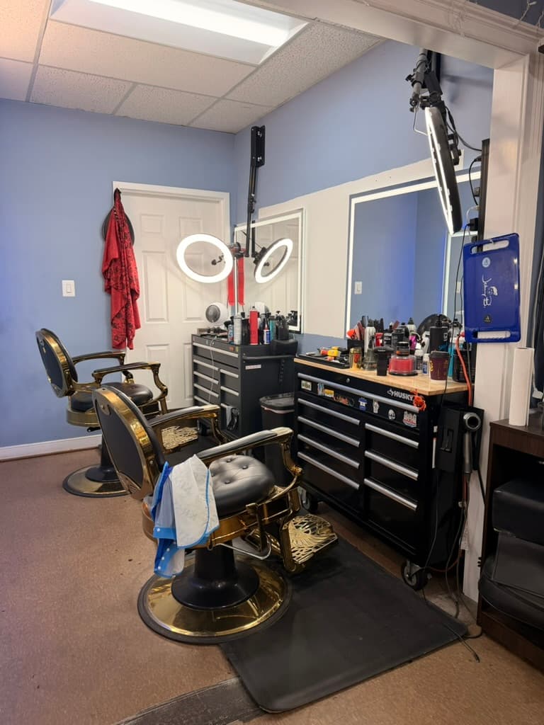 Classic black-and-gold barber chairs